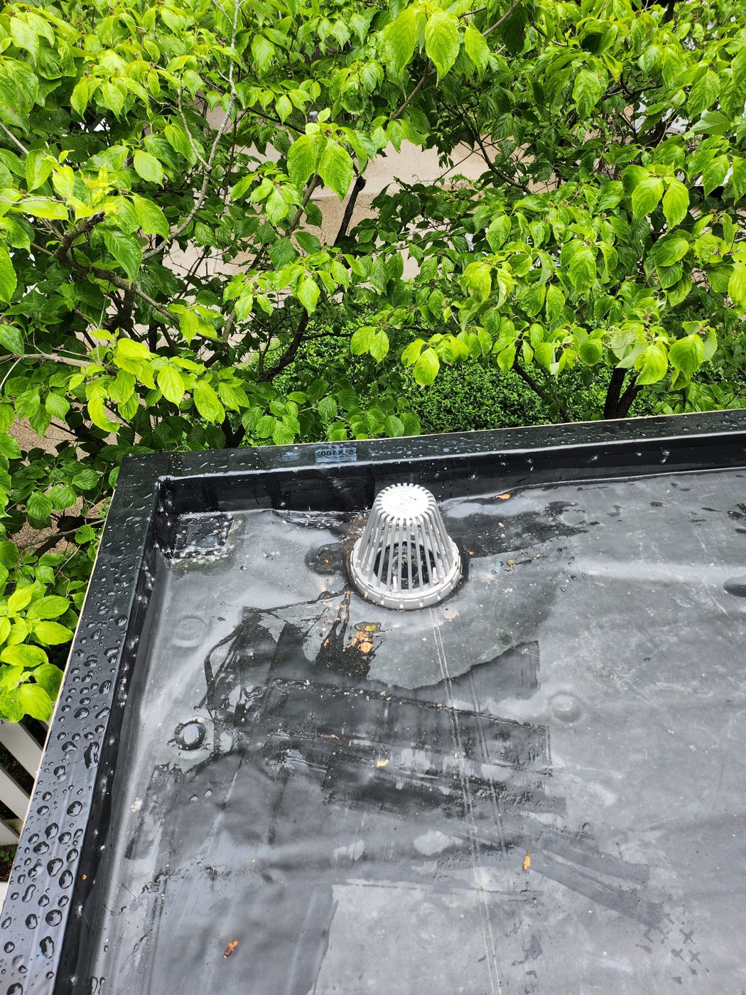 New EPDM roof drain with clean drainage and water sealed off the membrane