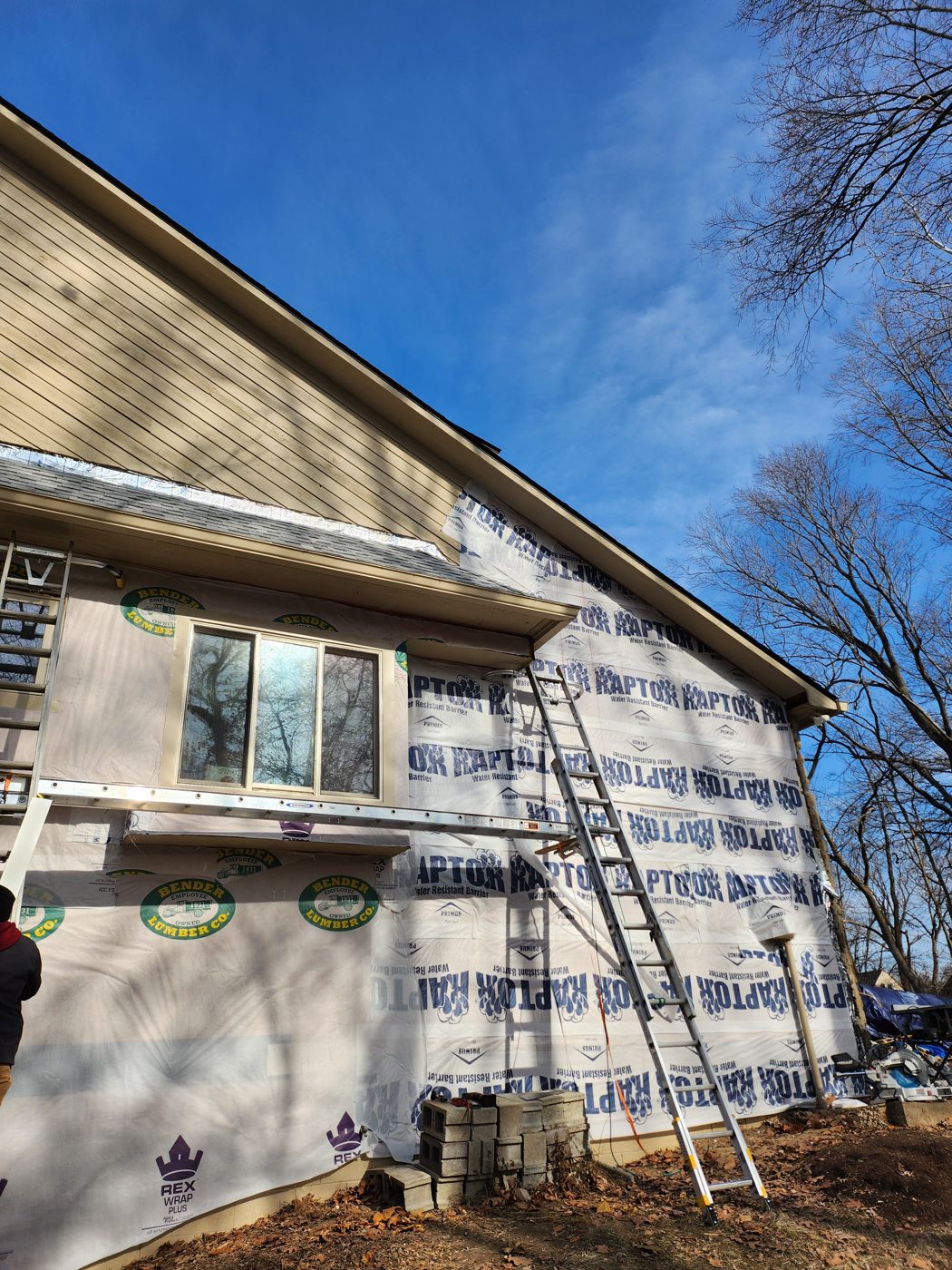 Home wrapped during siding installation